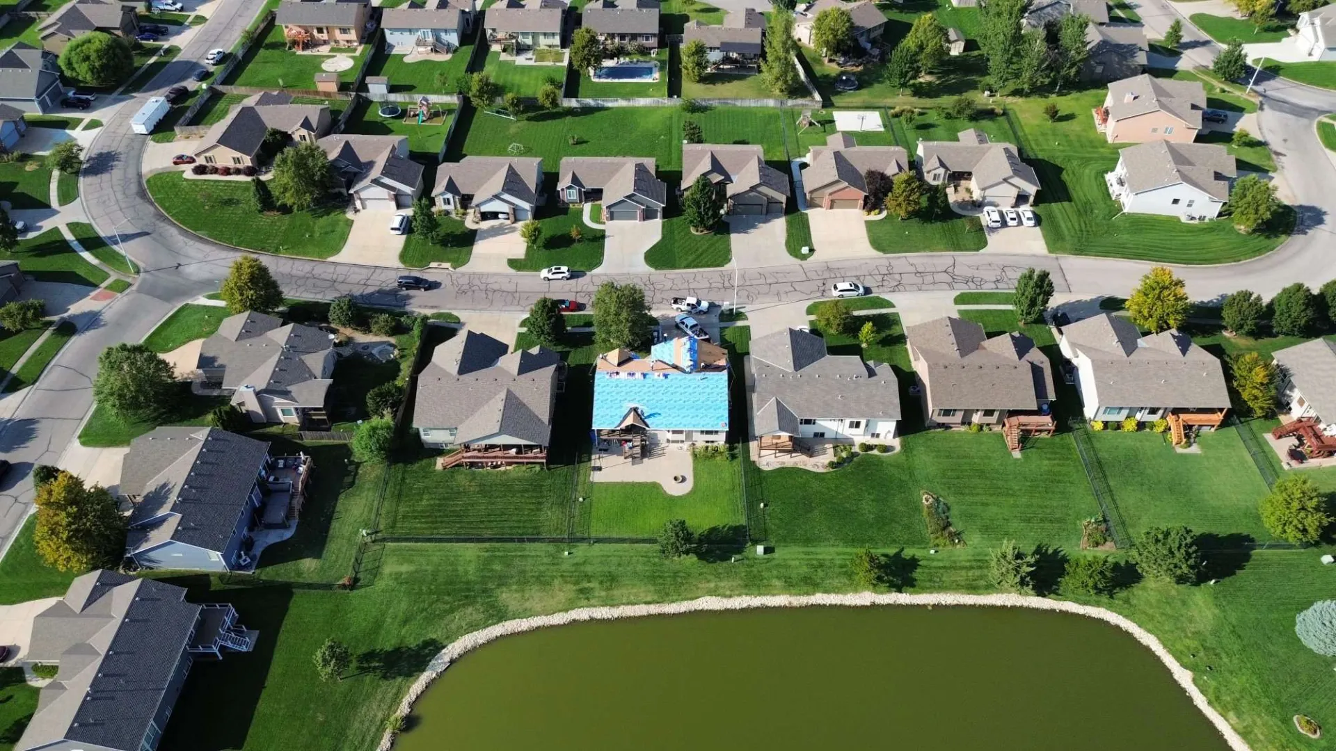 Aerial view of a Kansas neighborhood and an HD Roofing project